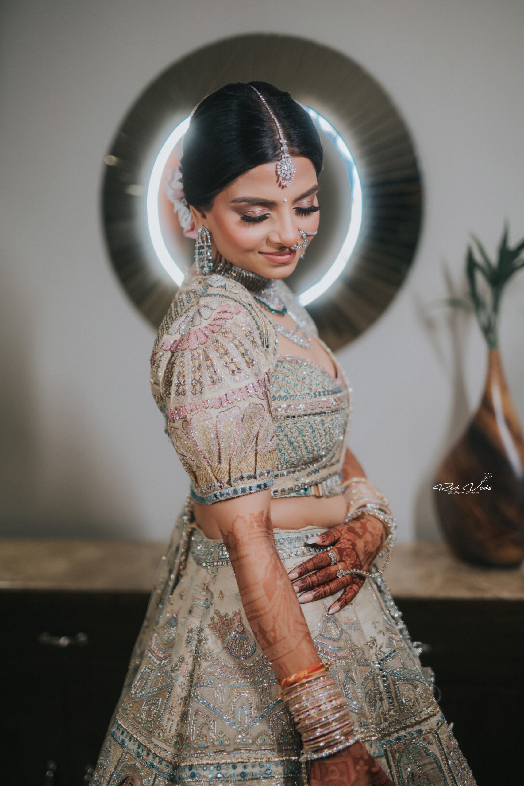 Portrait of an Indian bride posing with her husband in background Stock  Photo - Alamy