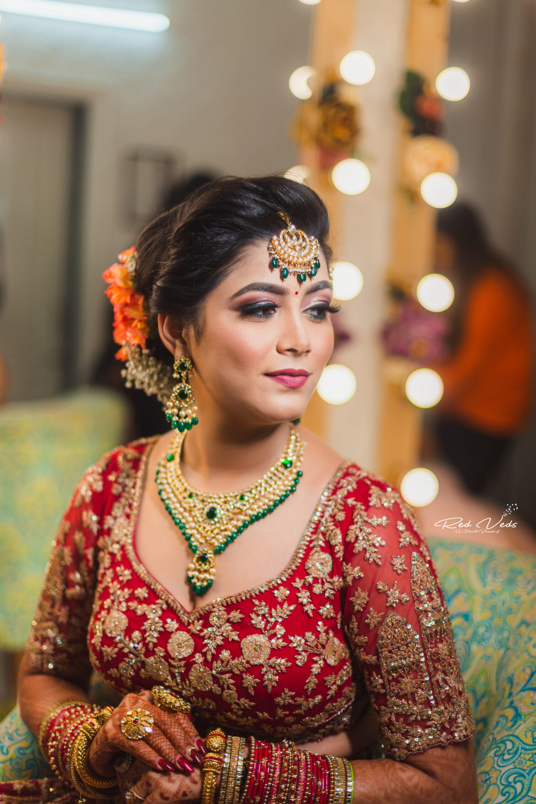 Photo of bridal makeup with red lehenga with deep red lips
