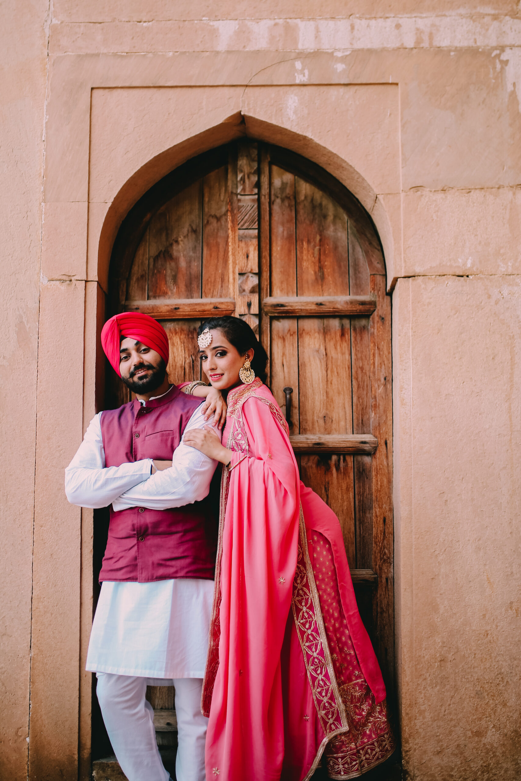 Punjabi Wedding Couple in Green and Pink Sari
