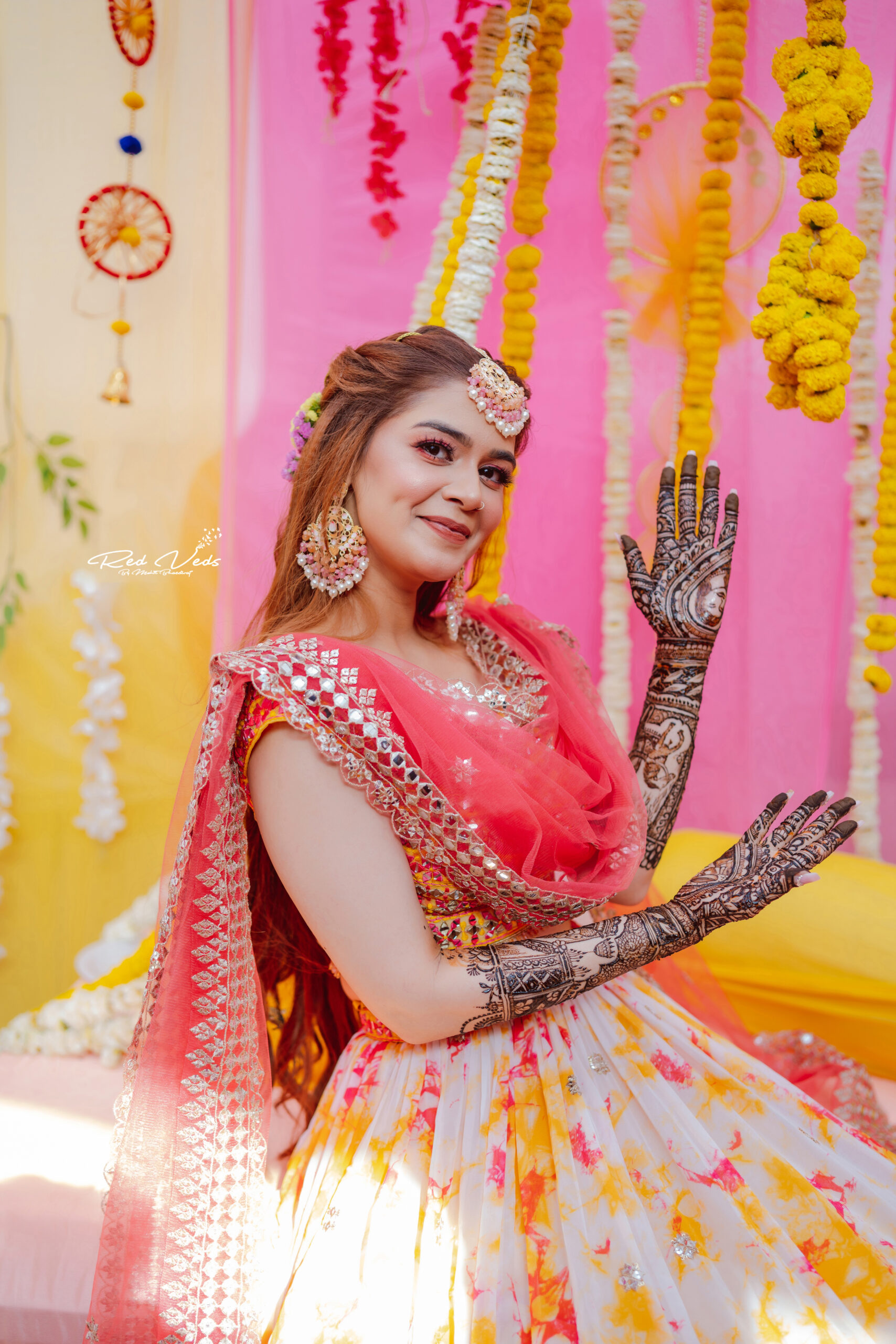 Photo of Bride showing off traditional bridal mehendi | Bridal mehendi  designs wedding, Bride photography poses, Indian wedding photography