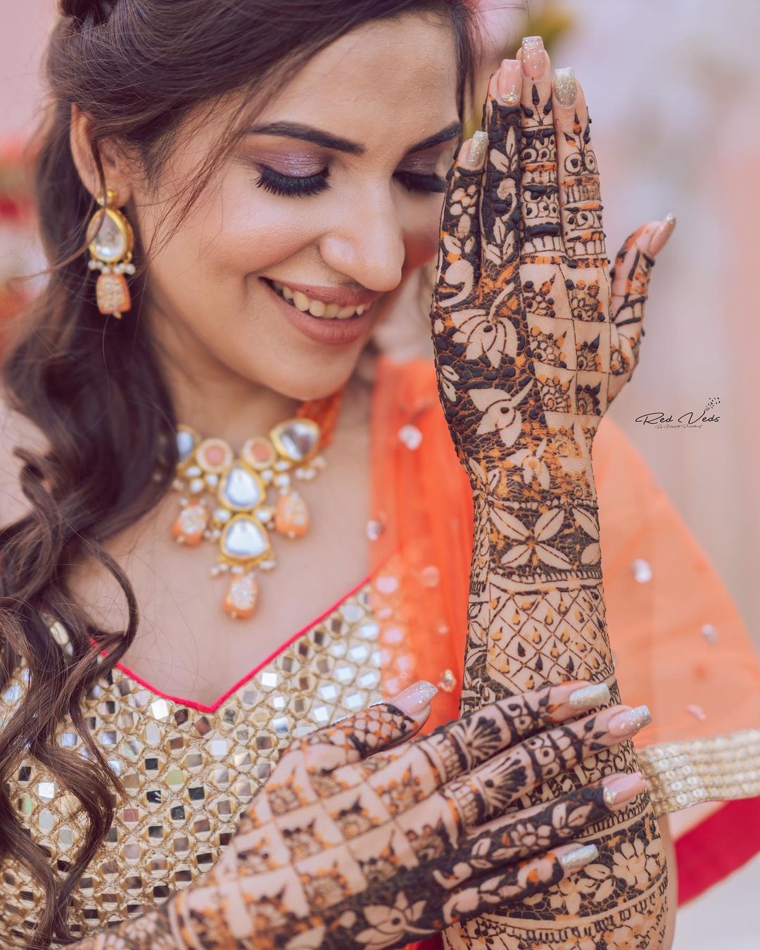 Woman Wearing Traditional Clothing and Mehendi Posing under a Garland ·  Free Stock Photo